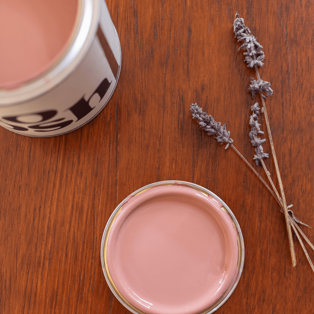 Rhythmic Red paint on a table with a sprig of lavendar