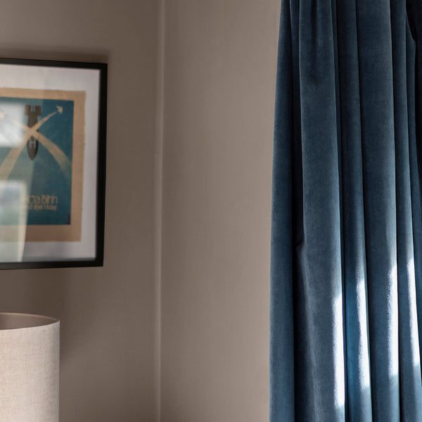 Close-up of a room decorated with After the Storm, one of Zhoosh Paint's darkest greys.