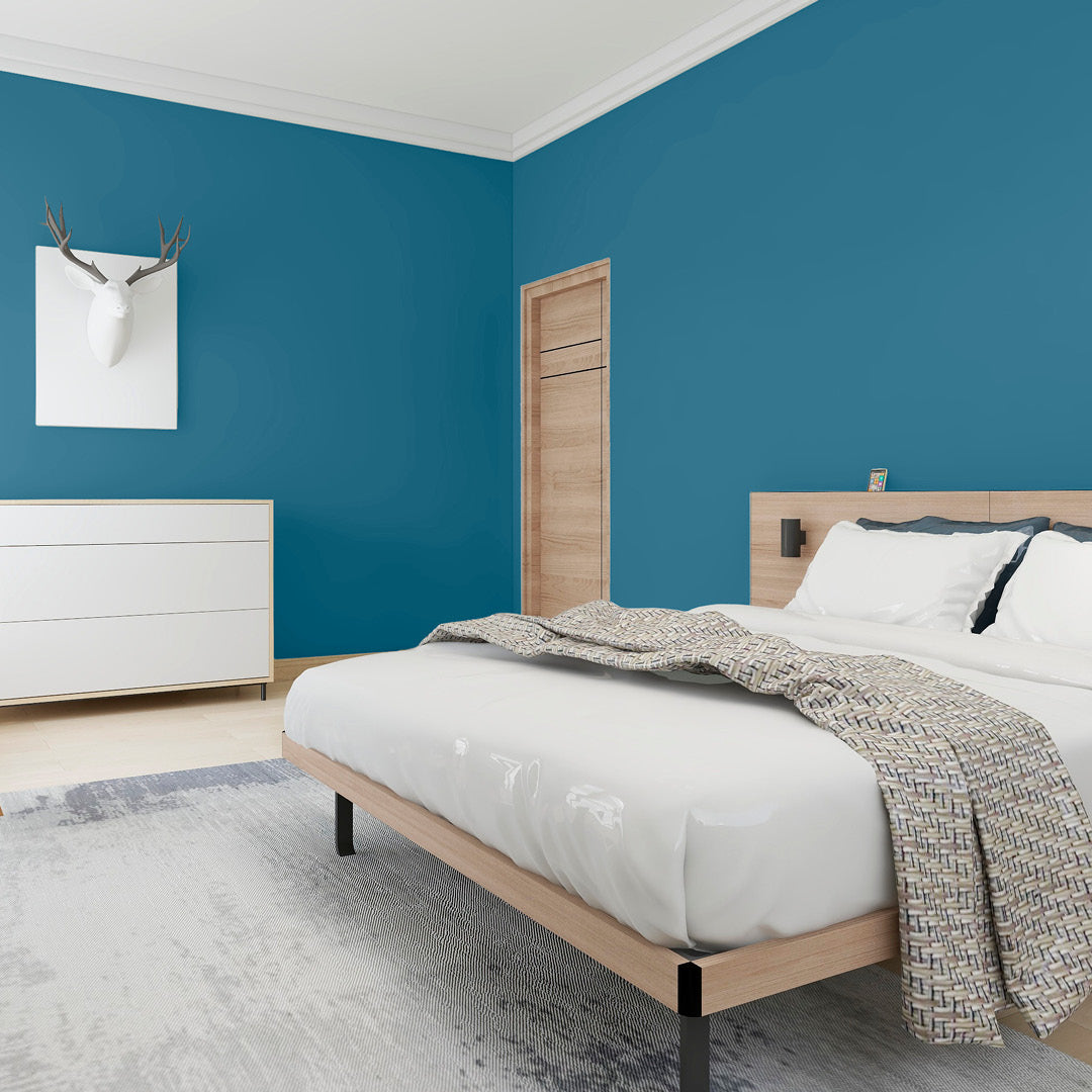 A bedroom decorated with Babbling Brook cobalt blue paint colour from Zhoosh Paints