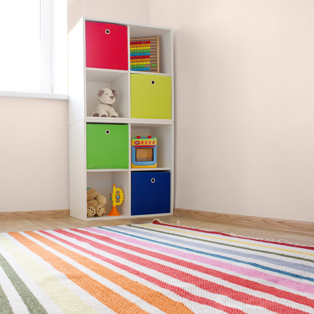 A child's playroom decorated in Calm Serenity, a pastel pink paint from Zhoosh.