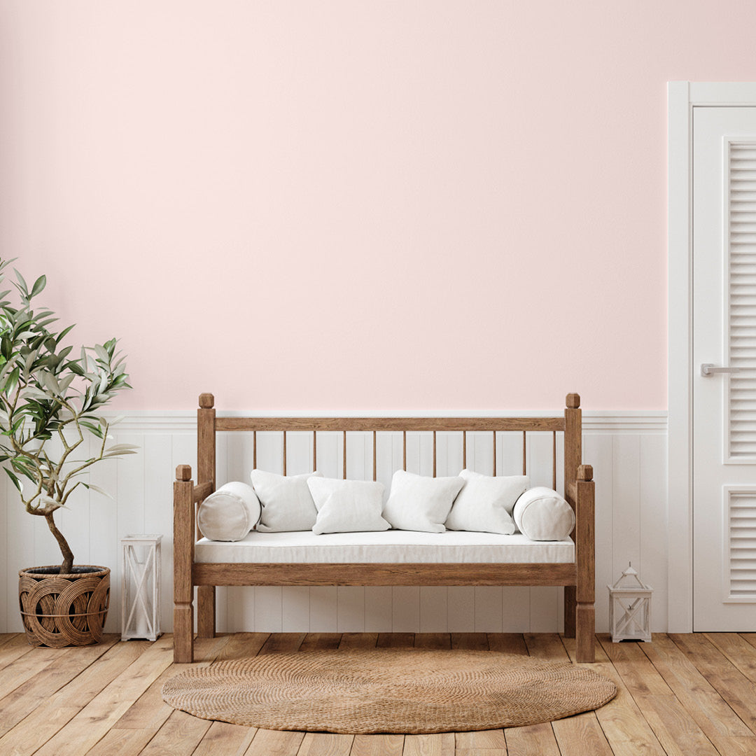 Bright and airy living room decorated in Cherry Blossom, a light pink wall paint from Zhoosh.