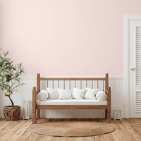 Bright and airy living room decorated in Cherry Blossom, a blush pink wall paint from Zhoosh.