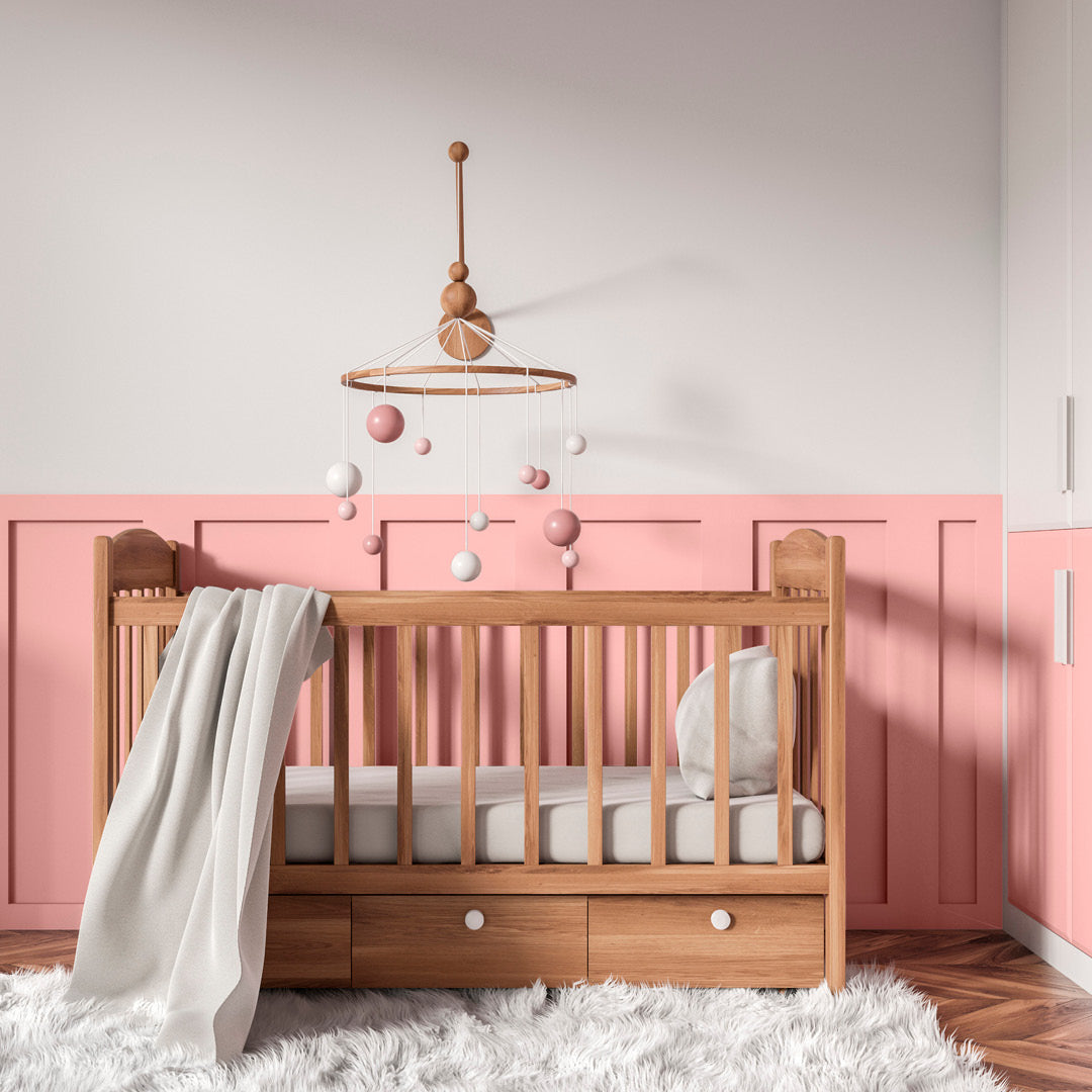 A nursery decorated in Flamboyance, a  child-safe bright pink paint from Zhoosh.