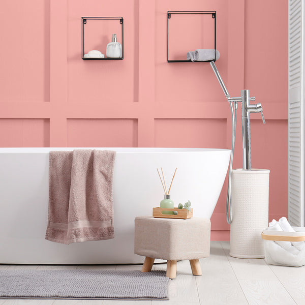 A modern bathroom decorated in Flamboyance, a bright pink paint from Zhoosh.