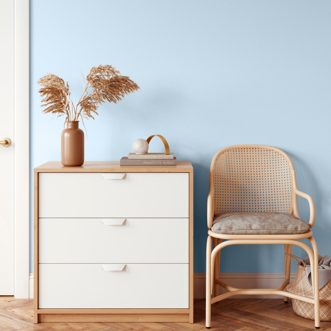 Bright and airy bedroom decorated in Glacier, a pastel blue paint from Zhoosh.