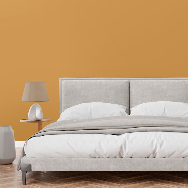 Bright and airy bedroom decorated in Hector, a yellow-orange paint from Zhoosh.