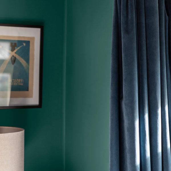 Corner of a living room decorated with In the Canopy, a warm green paint colour from Zhoosh.