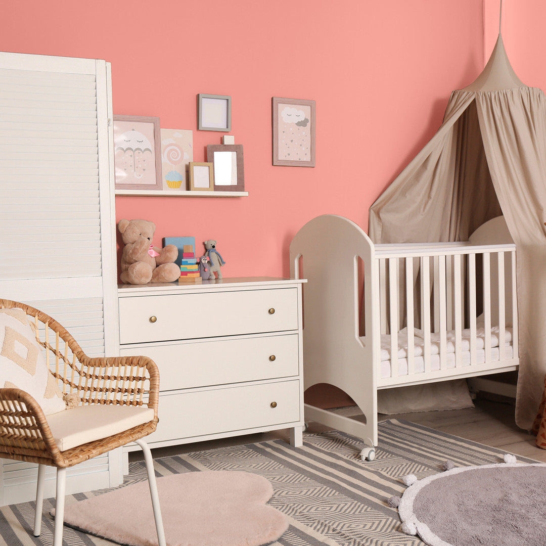 Bright and airy nursery decorated in Jaipur, a fuschia pink paint from Zhoosh.