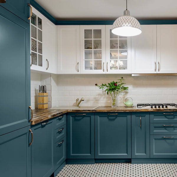 Clean, modern kitchen decorated in Lapping Lake, a dark blue grey paint from Zhoosh.