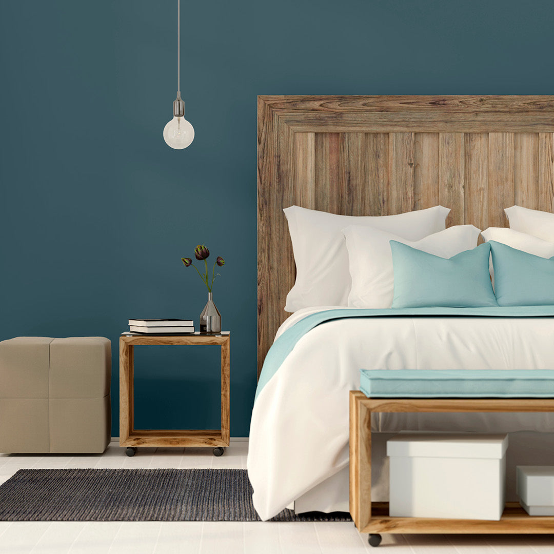 Clean and airy bedroom decorated in Lapping Lake, a dark blue green paint from Zhoosh.