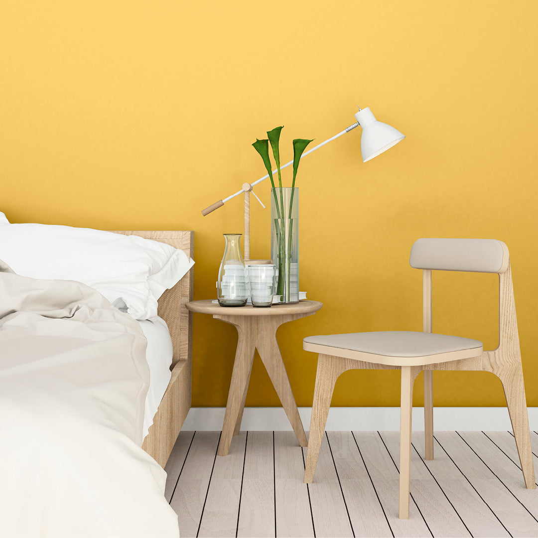 Clean, simple bedroom decorated in Lemon Sorbet, a lemon yellow paint from Zhoosh.