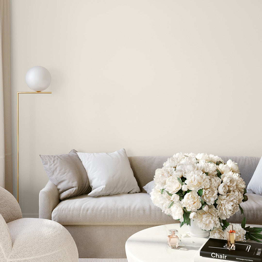 Bright and airy living room decorated in Moonglow, a warm off-white paint from Zhoosh.