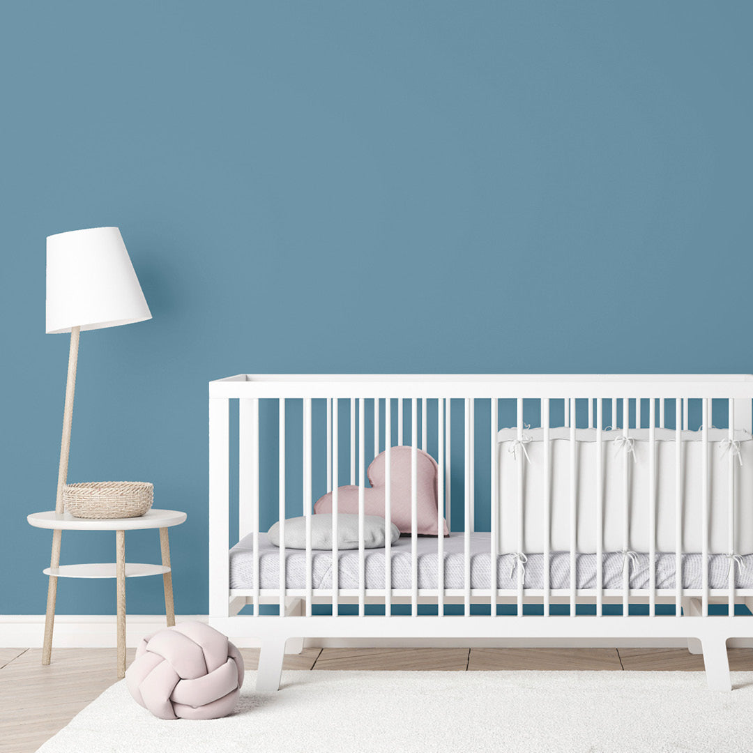 Nursery decorated in Morning Dip, a child-safe blue slate paint from Zhoosh.