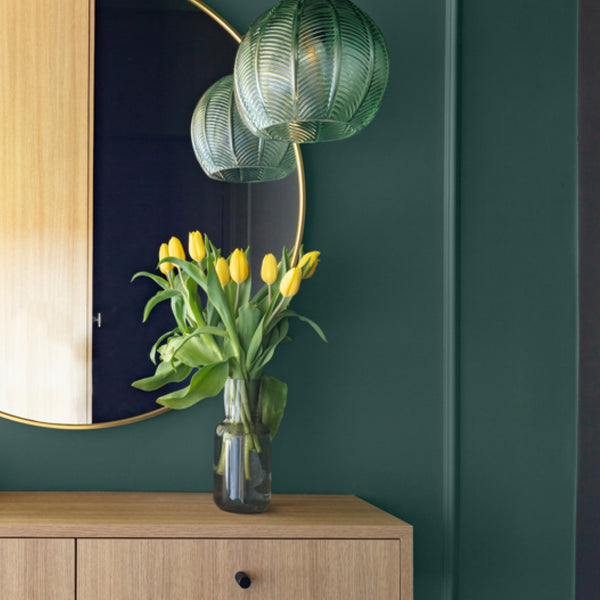 Minimalist bedoom decorated with New Forest Fern, a vintage green paint colour from Zhoosh.