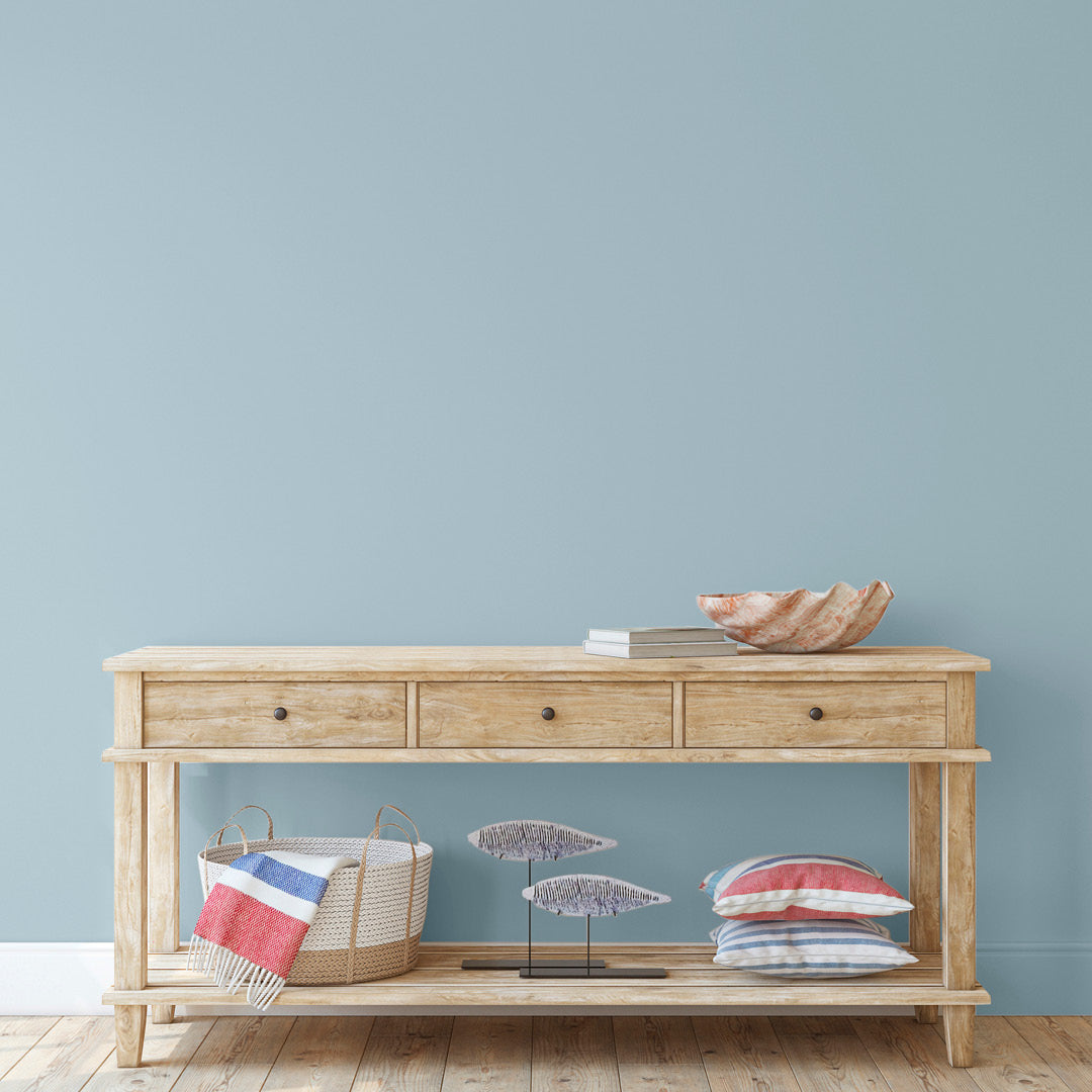 Reception room with walls decorated in Ocean Breeze, a greyish blue paint from Zhoosh.