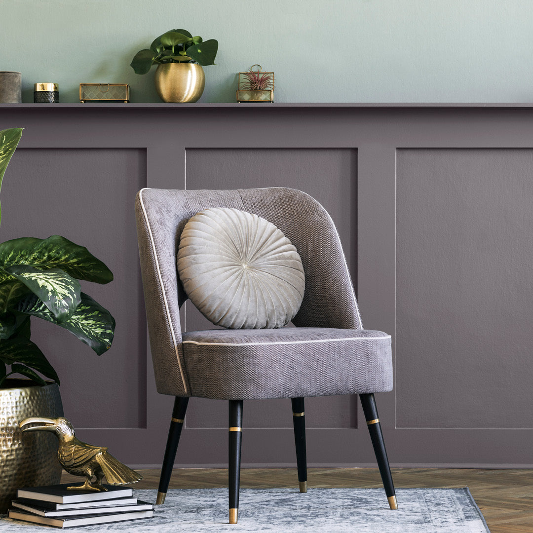 A living room with walls decorated with Raindrops, a steel grey paint from Zhoosh.