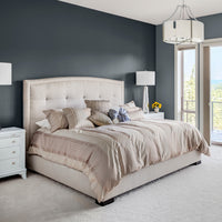 A bedroom with walls decorated with Rockpool, a charcoal grey paint from Zhoosh.