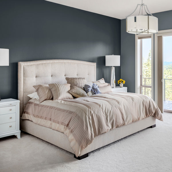 A bedroom with walls decorated with Rockpool, a dark grey colour paint from Zhoosh.