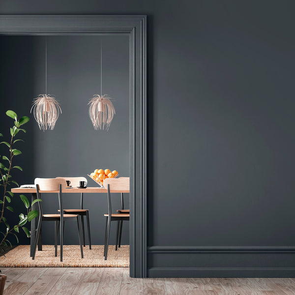 A hallway and dining room with walls decorated with Rockpool, a charcoal grey paint from Zhoosh.