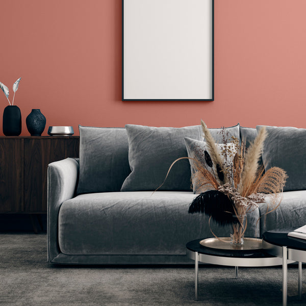 Living room with walls decorated with Sahara Dust, a rich red paint from Zhoosh.