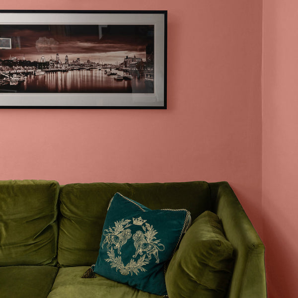 Living room with walls decorated with Sahara Dust, a rich red paint from Zhoosh.