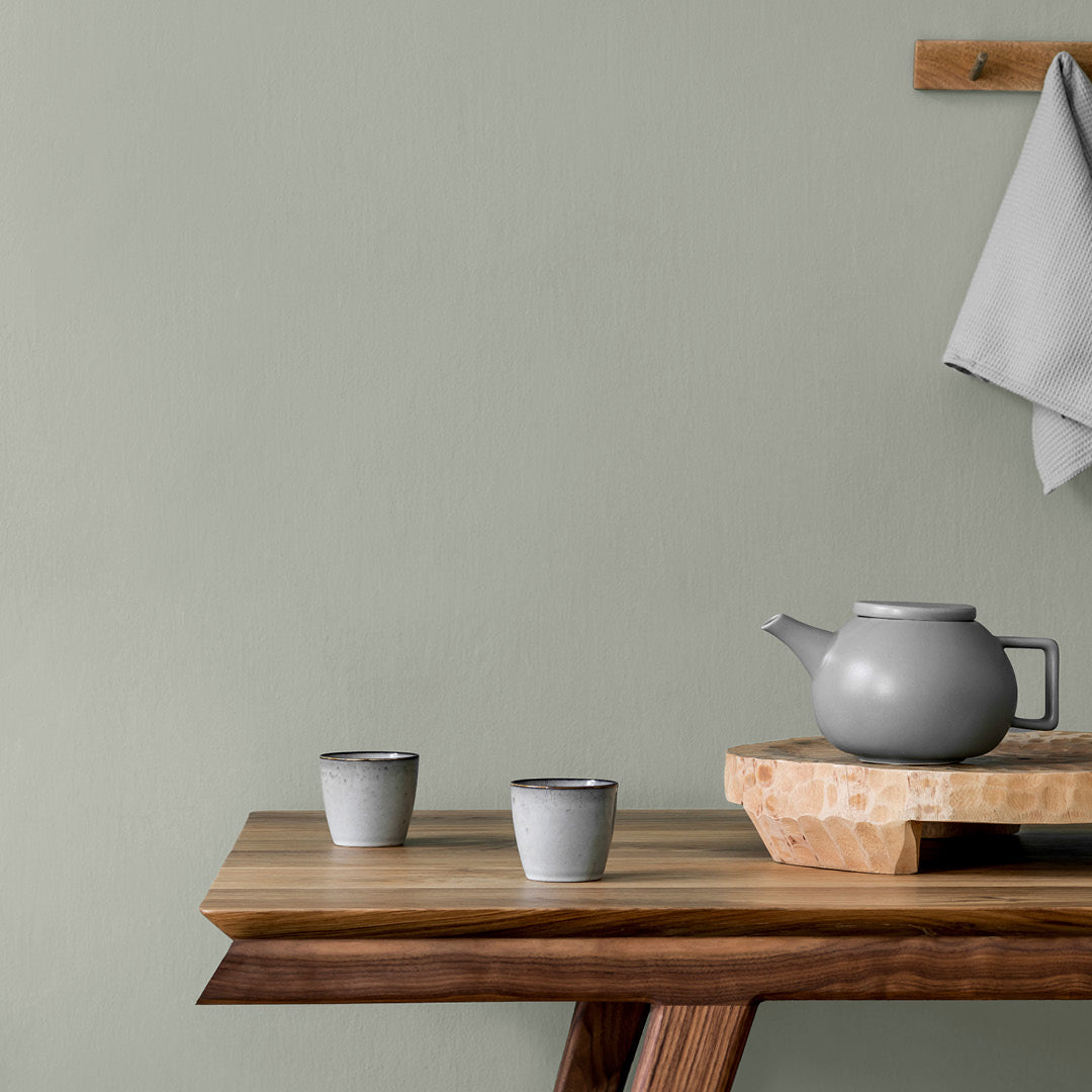 A kitchen prep area decorated with Through the Mist, an ash grey paint from Zhoosh Paints.