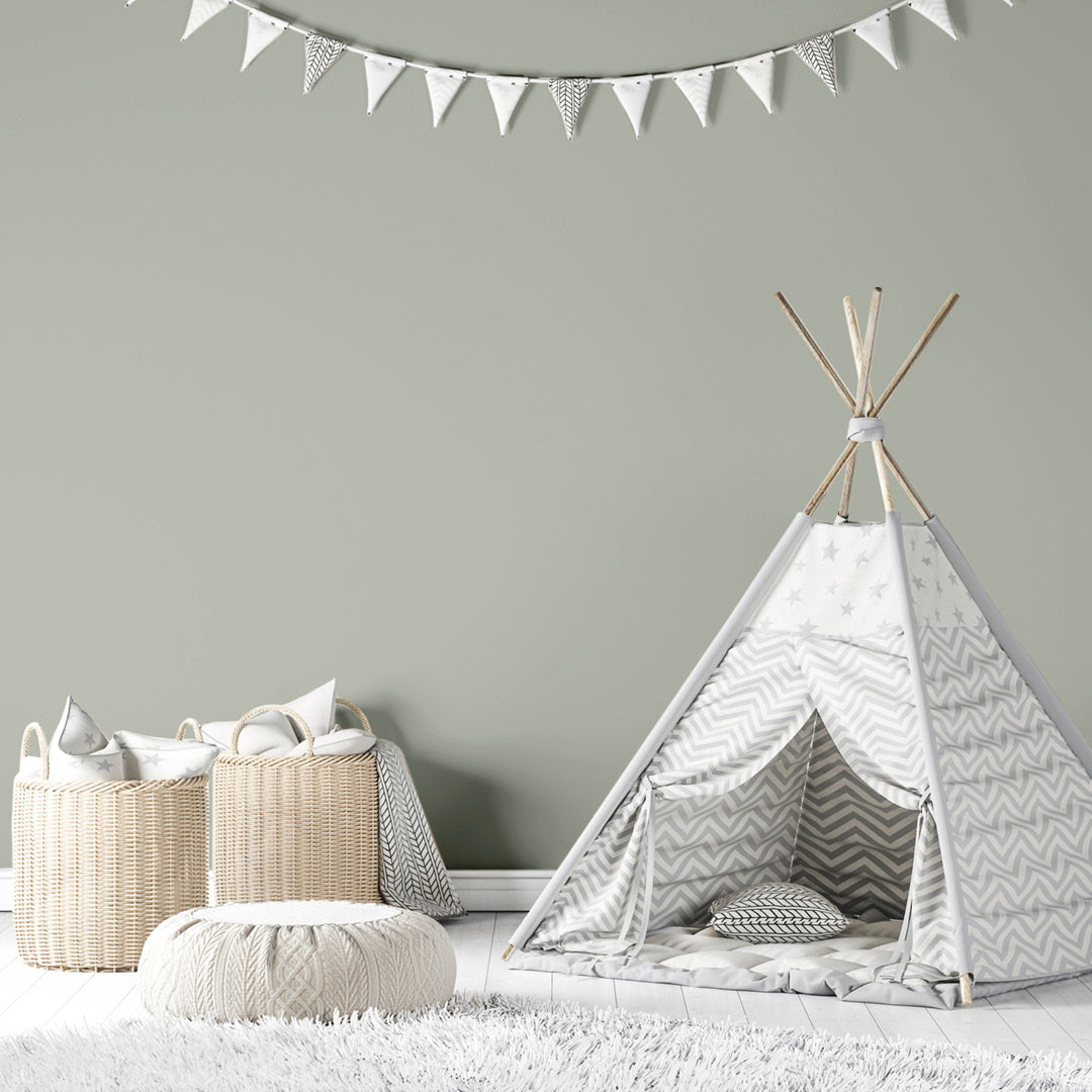 A nursery decorated with Through the Mist, a child-safe ash grey paint from Zhoosh Paints.