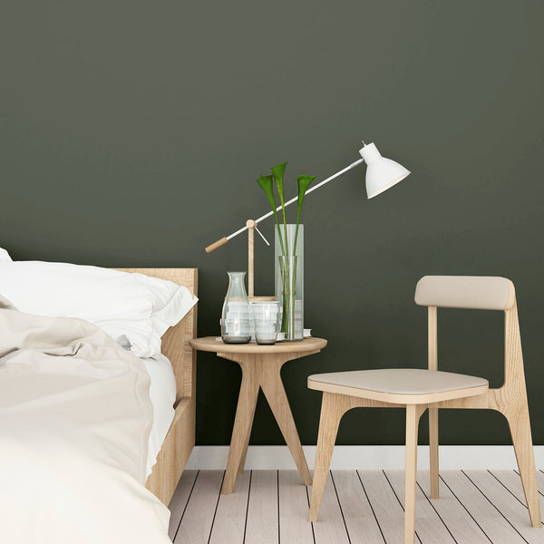 A bedroom decorated with Under the Oak Tree, a dark green paint from Zhoosh Paints.